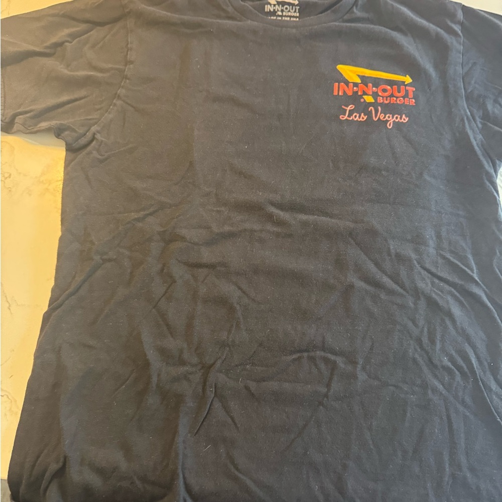 Source Unknown Black Tee with Orange and Yellow Logo